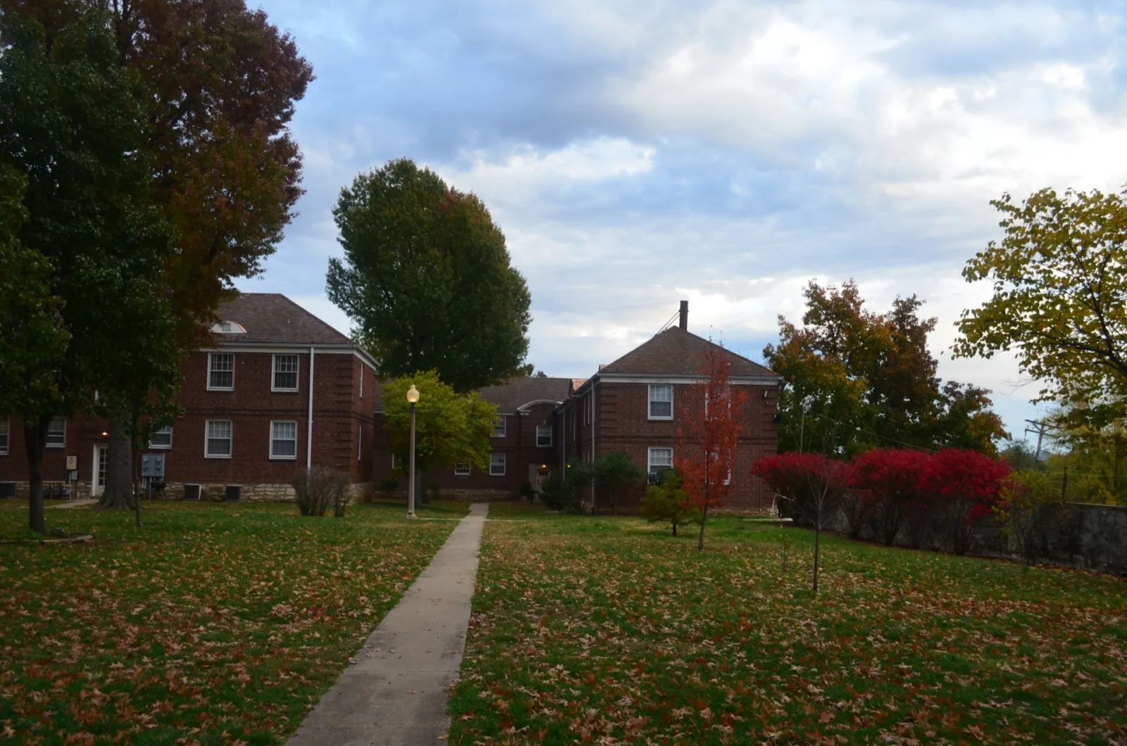 Wide view of Jefferson Heights Apartments grounds in fall
